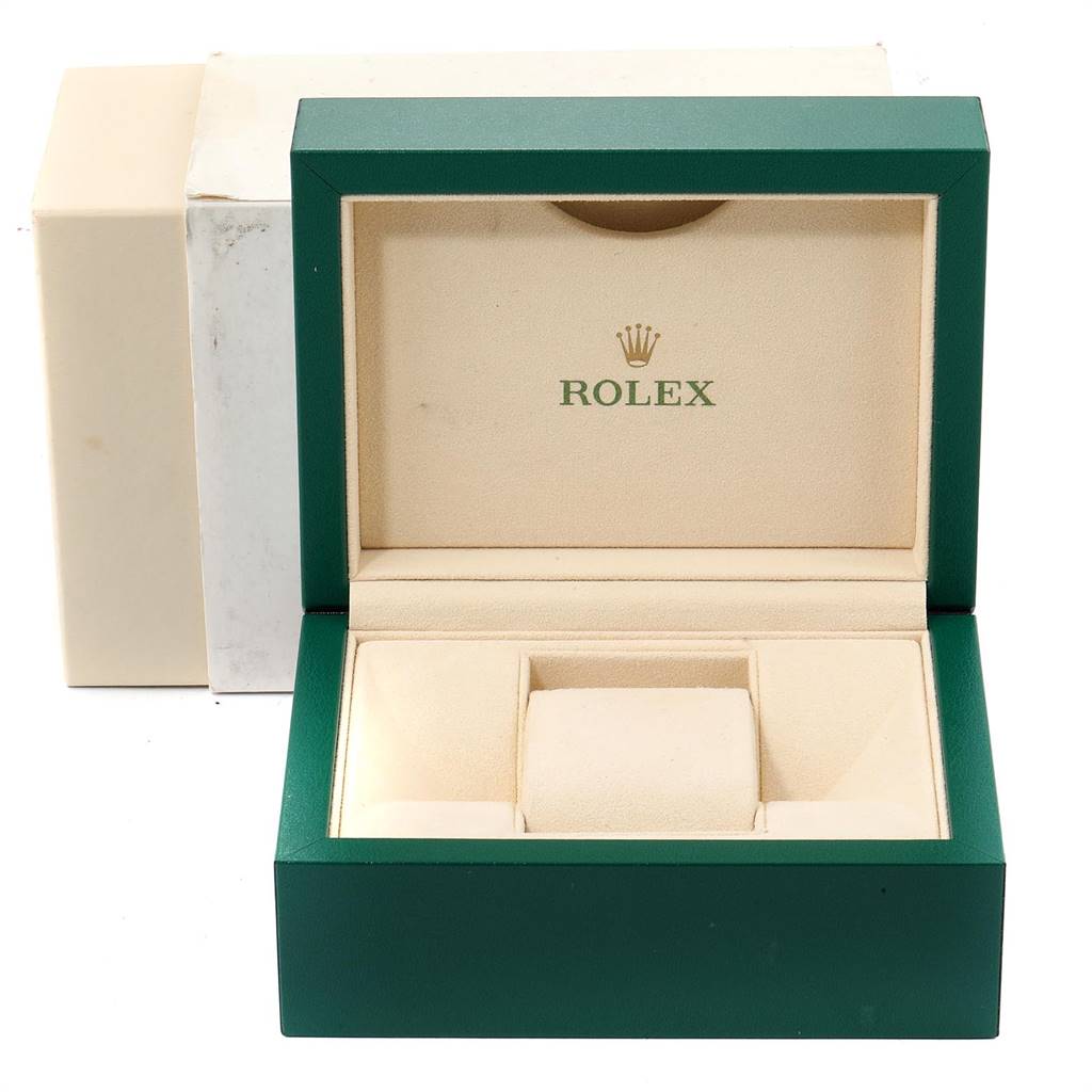 This image shows an open green Rolex Datejust 116233 Men
s Stainless Steel Silver Dial 116233 Men
s Stainless Steel Silver Dial watch box and its interior.