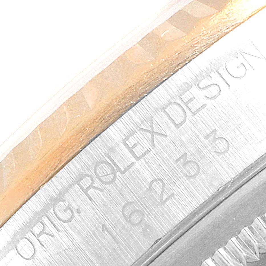 This image shows a close-up of the engraved rim on a Rolex Datejust 16233 Men's Steel and Gold (two tone) White Dial 16233 Men's Steel and Gold (two tone) White Dial watch.