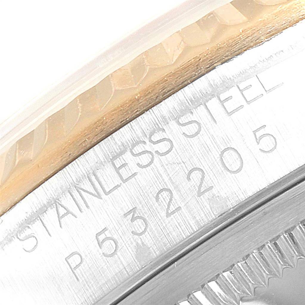 This close-up image shows the stainless steel case and engraved model number of a Rolex Datejust 16233 Men's Steel and Gold (two tone) White Dial 16233 Men's Steel and Gold (two tone) White Dial watch.