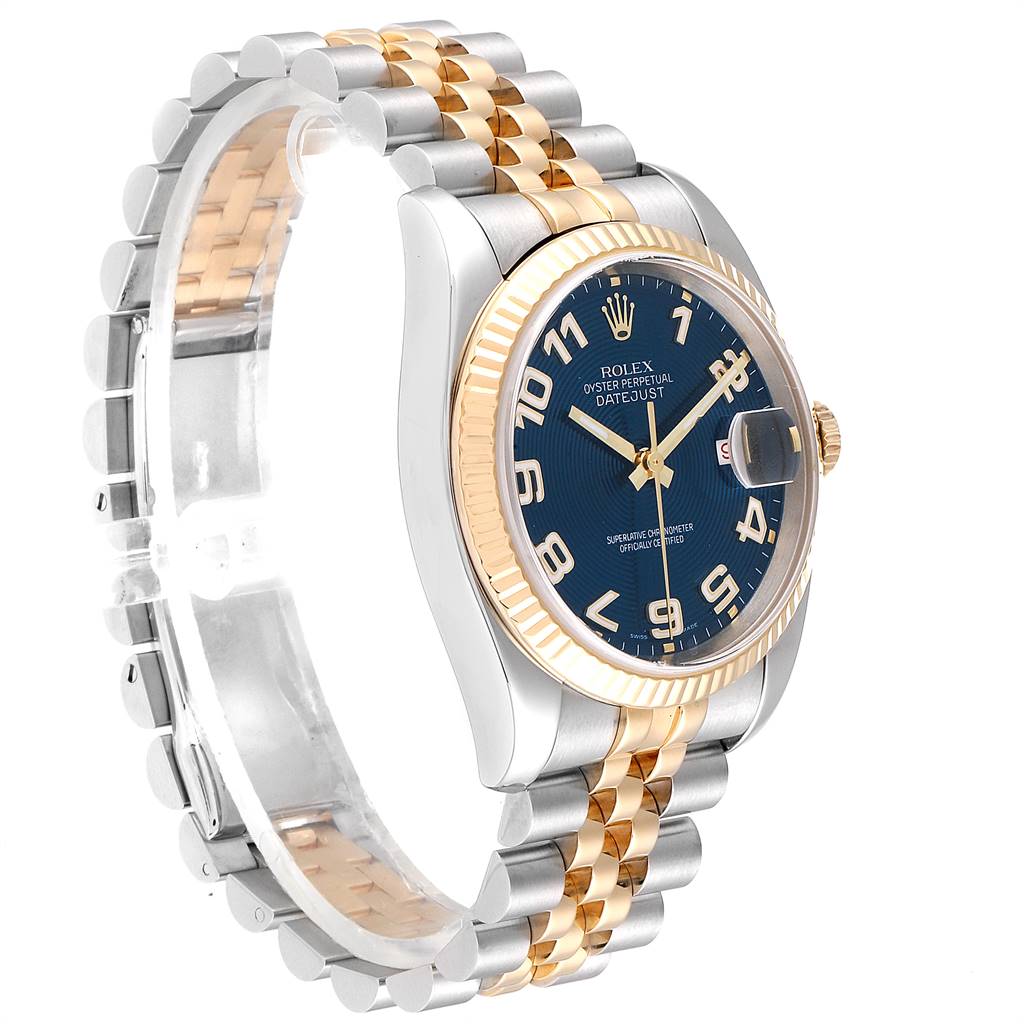 The watch is a Rolex Datejust 116233 Men
s Steel and Gold (two tone) Blue Dial 116233 Men
s Steel and Gold (two tone) Blue Dial model shown from a front-left angle, highlighting its bezel, dial, and two-tone bracelet.