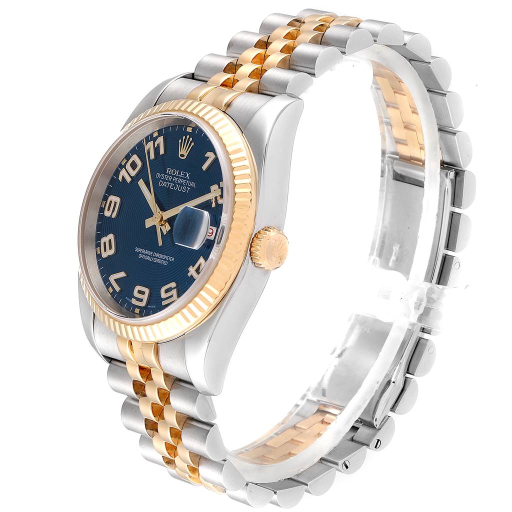 This Rolex Datejust 116233 Men
s Steel and Gold (two tone) Blue Dial 116233 Men
s Steel and Gold (two tone) Blue Dial watch is shown at a slight angle revealing the face, bezel, crown, and jubilee bracelet.