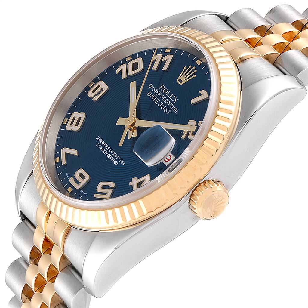 The image shows a close-up angled view of the Rolex Datejust 116233 Men
s Steel and Gold (two tone) Blue Dial 116233 Men
s Steel and Gold (two tone) Blue Dial watch face, bezel, and part of the bracelet.