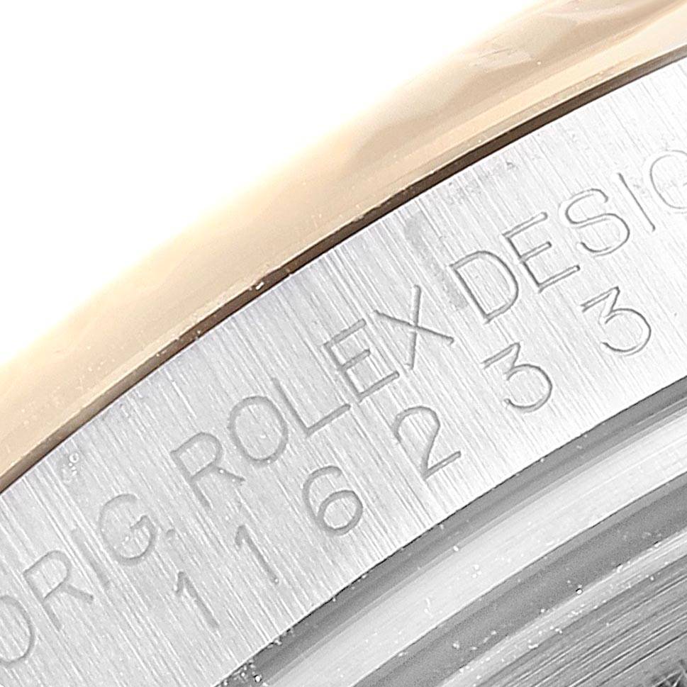 The image shows a close-up of the case side and serial number engraving of a Rolex Datejust 116233 Men's Stainless Steel White Dial 116233 Men's Stainless Steel White Dial watch.