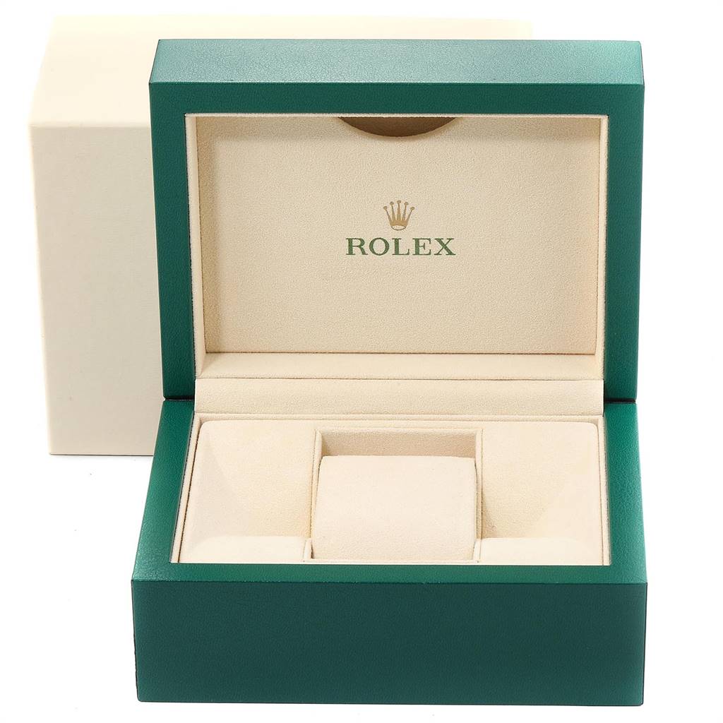 The image shows an open Rolex Datejust 126234 Men's Stainless Steel Blue Dial 126234 Men's Stainless Steel Blue Dial watch box with beige interior and green exterior.