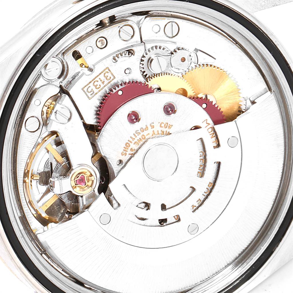 The image displays the intricate internal mechanism of a Rolex Datejust 16233 Men's Steel and Gold (two tone) White Dial 16233 Men's Steel and Gold (two tone) White Dial watch from a close-up rear angle.