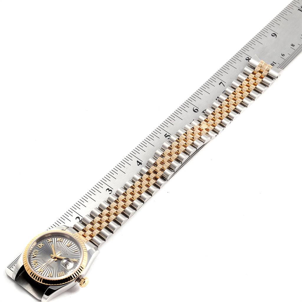 The image shows a Rolex Datejust 116233 Men's Stainless Steel Grey Dial 116233 Men's Stainless Steel Grey Dial watch from an overhead angle, displaying the face, bracelet, and part of a ruler for measurement.