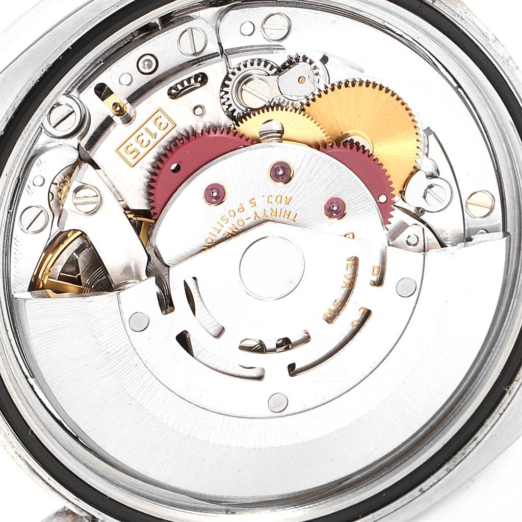 This is a close-up image of the internal movement and components of a Rolex Datejust 116233 Men's Steel and Gold (two tone) Beige Dial 116233 Men's Steel and Gold (two tone) Beige Dial model watch.