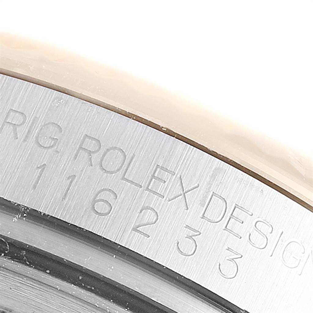 The image shows a close-up of the brushed steel case back of a Rolex Datejust 116233 Men's Steel and Gold (two tone) Beige Dial 116233 Men's Steel and Gold (two tone) Beige Dial watch, displaying the model and brand engraving.
