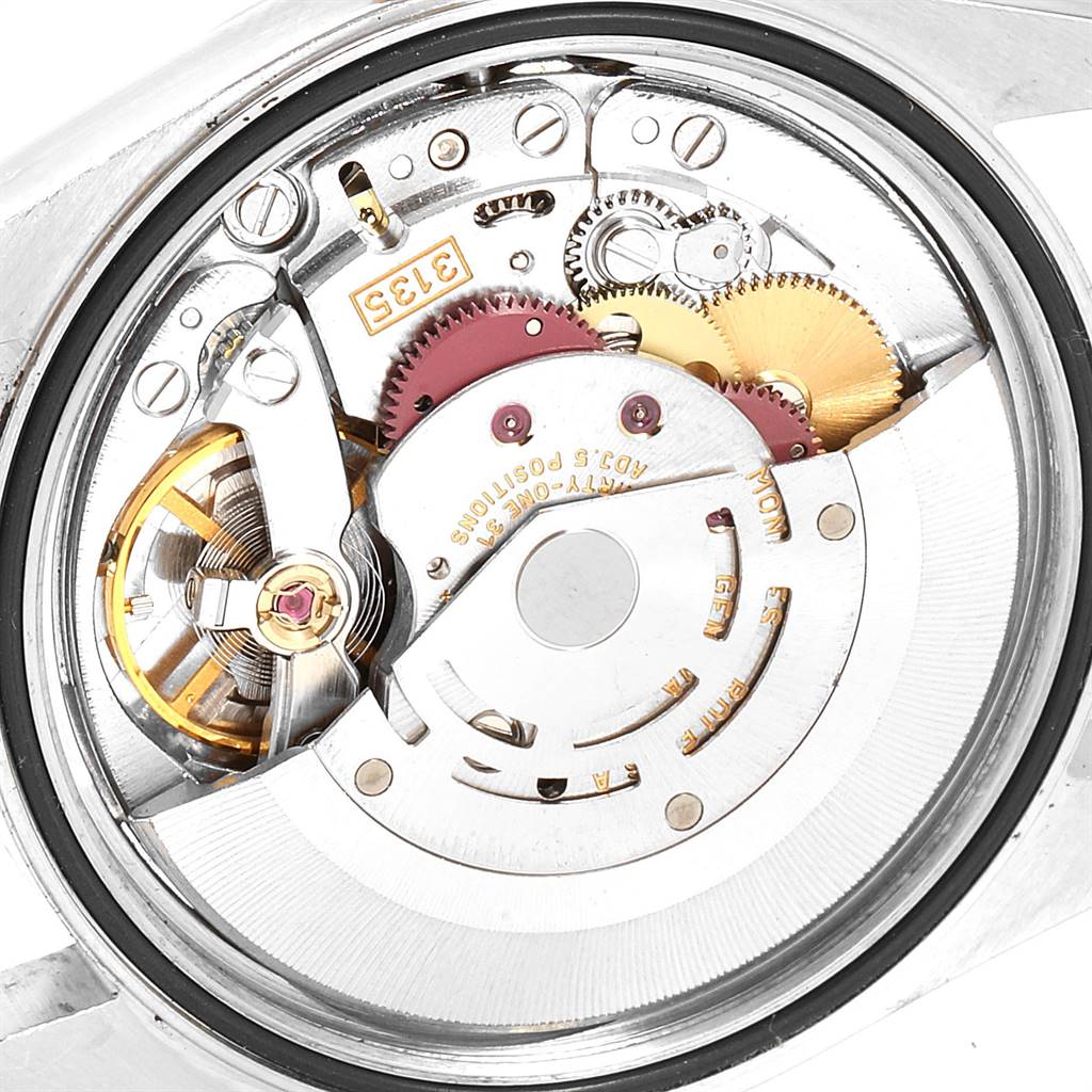 The image shows the internal mechanical movement of a Rolex Datejust 16233 Men
s Steel and Gold (two tone) Grey Dial 16233 Men
s Steel and Gold (two tone) Grey Dial watch from a back angle.