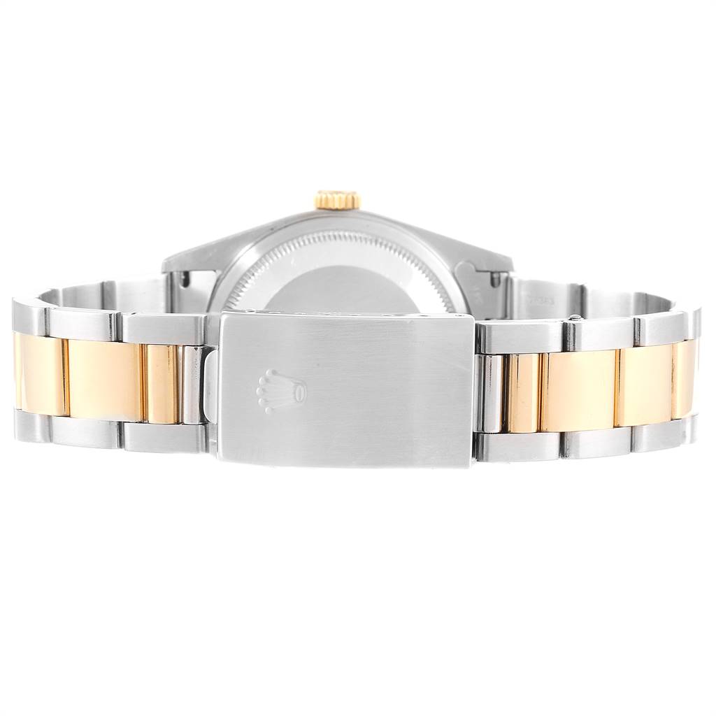 The image shows the rear view of a Rolex Datejust 16233 Men
s Steel and Gold (two tone) Grey Dial 16233 Men
s Steel and Gold (two tone) Grey Dial watch, focusing on its two-tone bracelet and clasp.