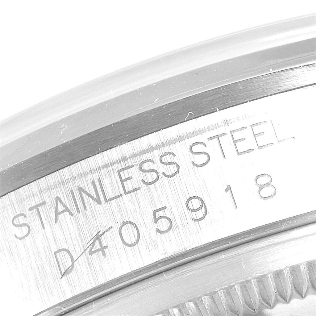 This is a close-up image of the serial number and material engraving on the side of a Rolex Datejust 16200 Men's Stainless Steel Silver Dial 16200 Men's Stainless Steel Silver Dial watch case.