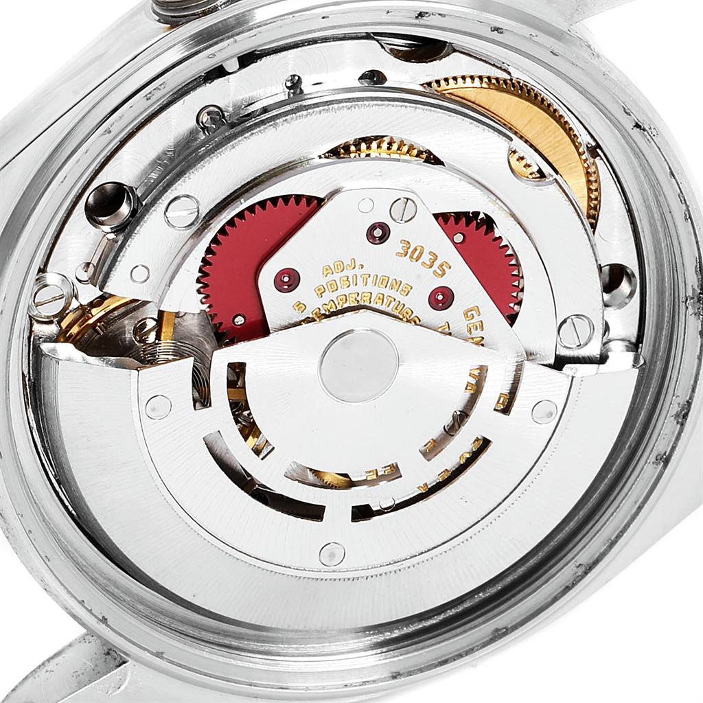 This image shows the intricate inner mechanism of a Rolex Datejust 16013 Men
s Stainless Steel Champagne Dial 16013 Men
s Stainless Steel Champagne Dial watch, highlighting gears and the movement.