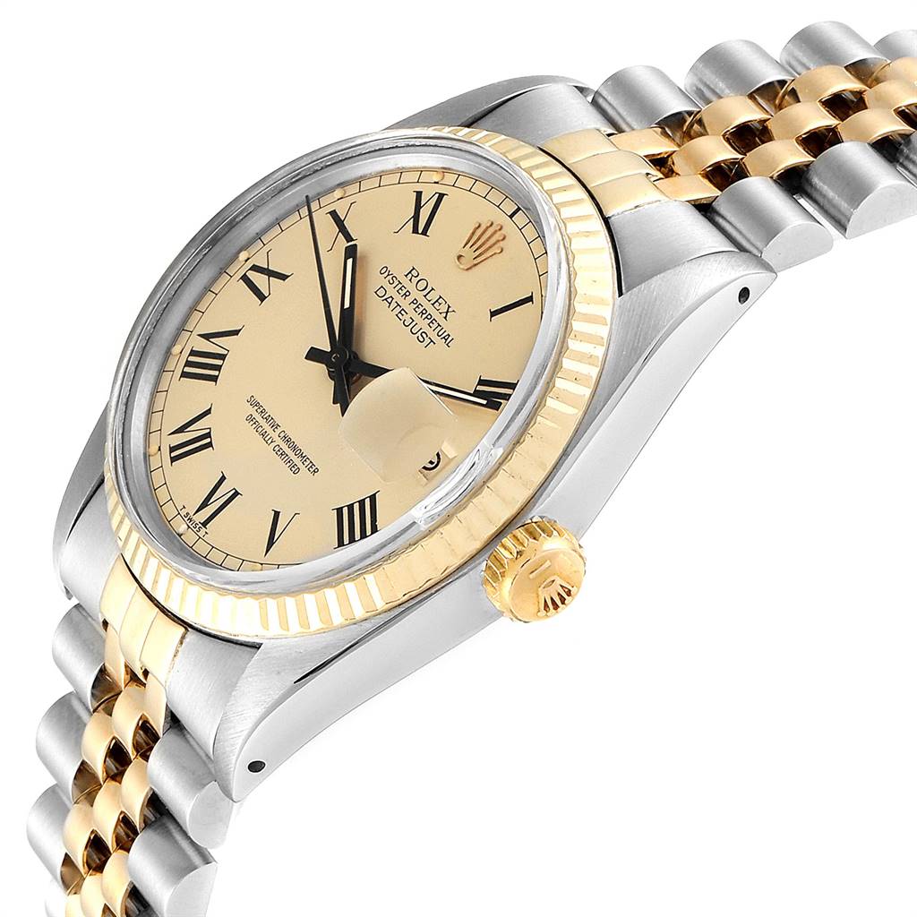 This image shows an angled view of a Rolex Datejust 16013 Men
s Stainless Steel Champagne Dial 16013 Men
s Stainless Steel Champagne Dial watch featuring the dial, crown, case, and part of the two-tone bracelet.