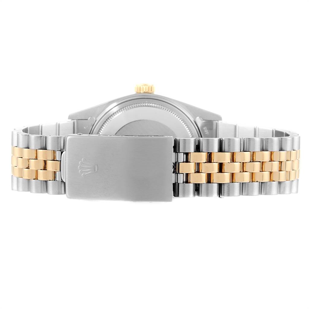 This image shows the case back and bracelet of a Rolex Datejust 16013 Men
s Stainless Steel Champagne Dial 16013 Men
s Stainless Steel Champagne Dial watch with a two-tone design.