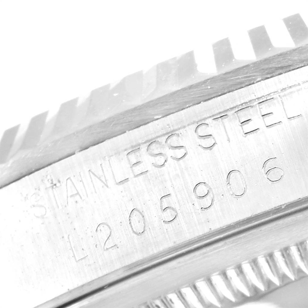 This image shows a close-up of the stainless steel case and fluted bezel of the Rolex Datejust 16234 Men's Stainless Steel Silver Dial 16234 Men's Stainless Steel Silver Dial.