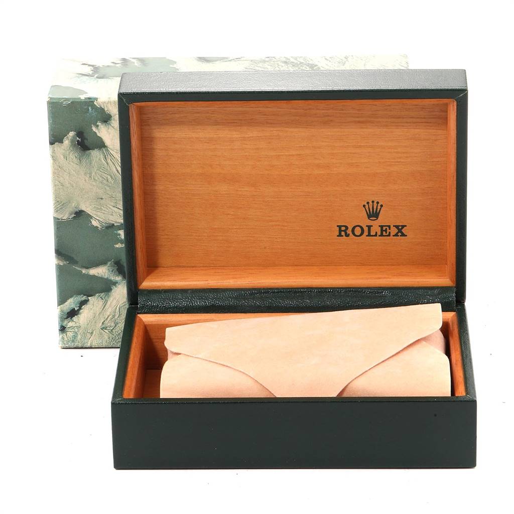 The image shows an open Rolex watch box with a cushion inside for the Datejust model watch.