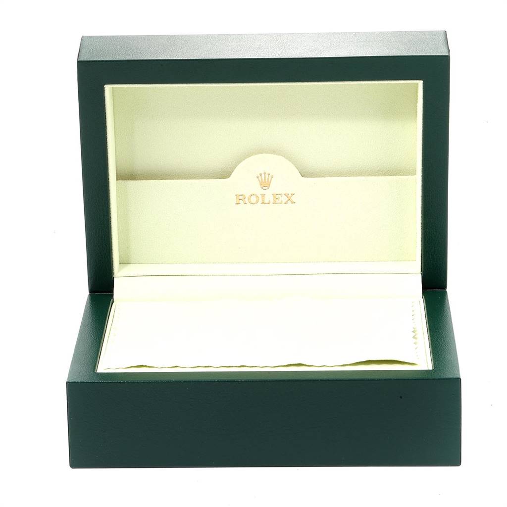 This image shows an open green Rolex box for the Datejust model, displaying the interior with the brand logo.