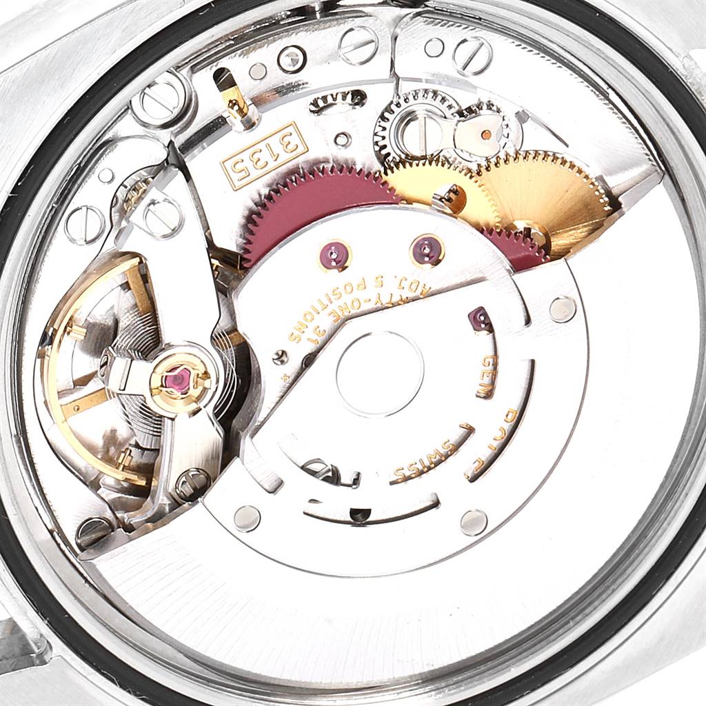 The image shows a close-up of the mechanical movement parts of a Rolex Datejust 116231 Men's Steel and Gold (two tone) Pink Dial 116231 Men's Steel and Gold (two tone) Pink Dial watch.
