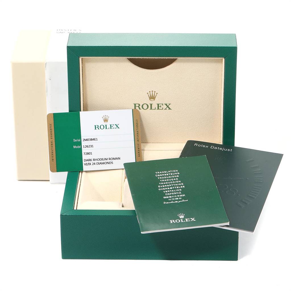 This image shows the accessories of a Rolex Datejust 126231 Men's Steel and Gold (two tone) Grey Dial 126231 Men's Steel and Gold (two tone) Grey Dial, including the box, warranty card, and instruction manuals.