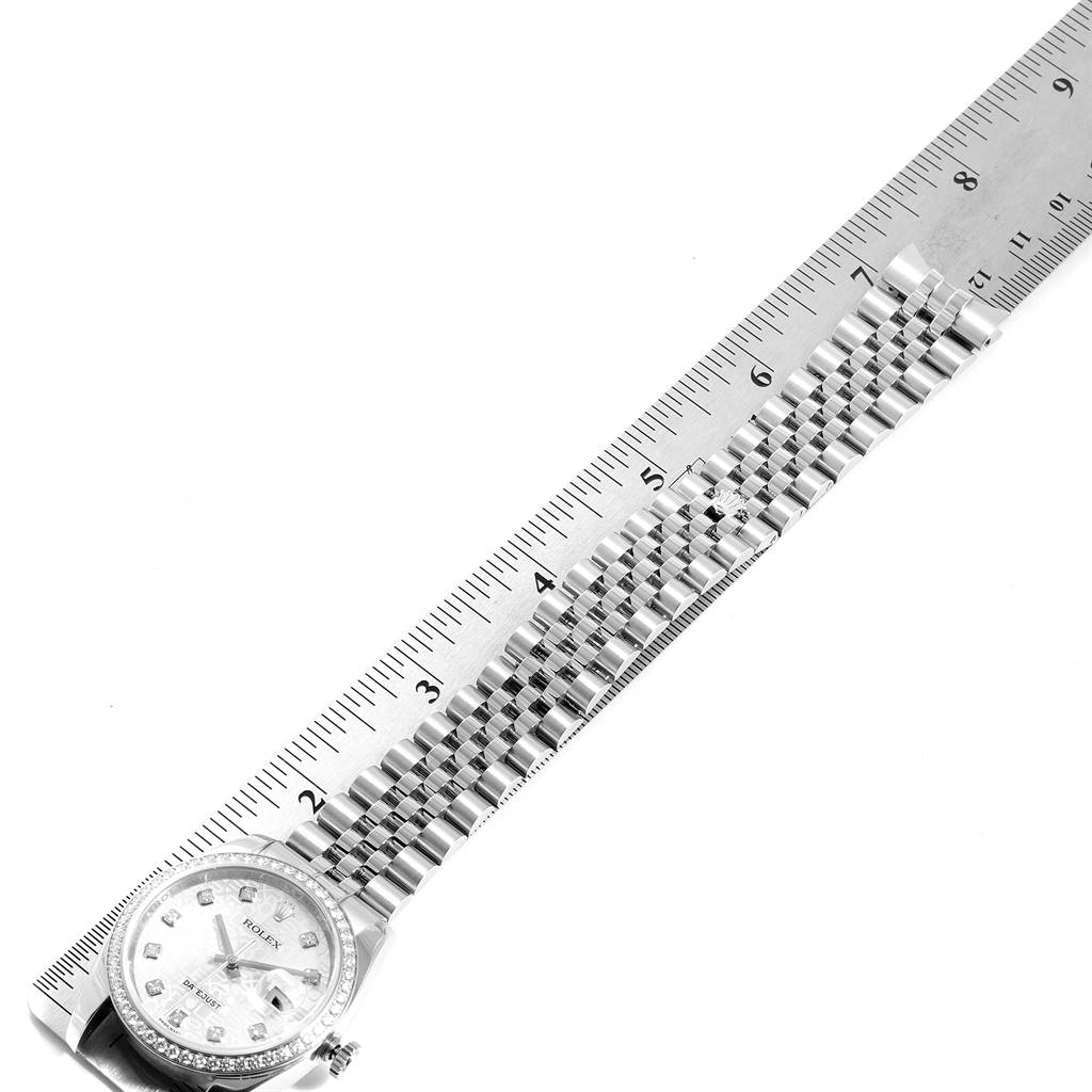 The image shows a Rolex Datejust 116244 Men's Stainless Steel Silver Dial 116244 Men's Stainless Steel Silver Dial watch, focusing on the face and bracelet laid beside a ruler for measurement.