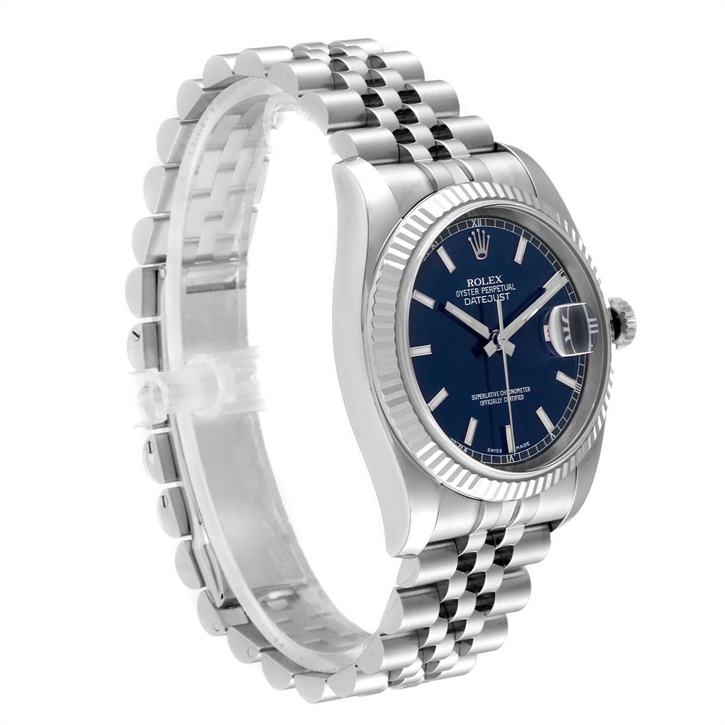 The image shows a side view of a Rolex Datejust 116234 Men's Stainless Steel Blue Dial 116234 Men's Stainless Steel Blue Dial watch, highlighting the face, fluted bezel, and jubilee bracelet.