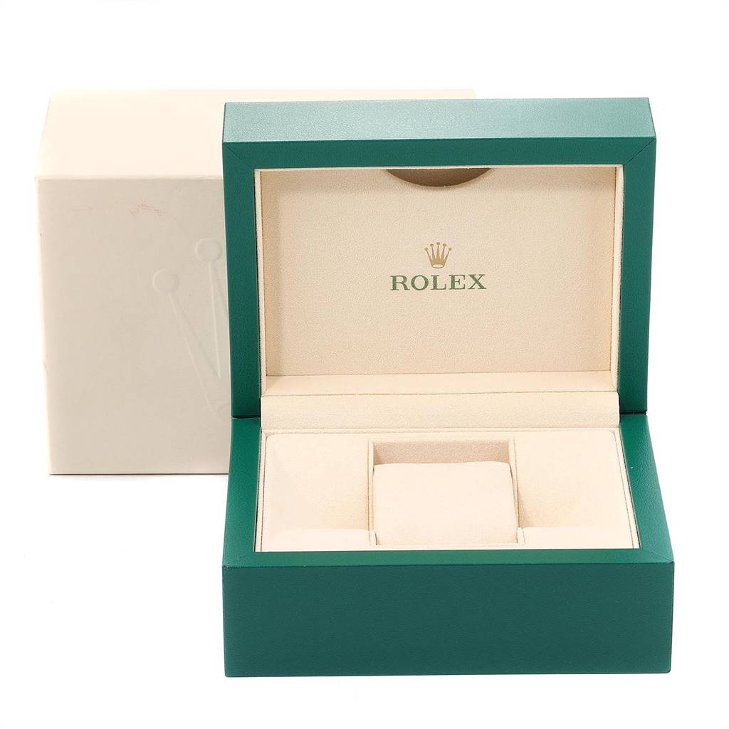 The image shows a green and cream Rolex watch box for a Datejust model, opened to reveal the interior compartments.