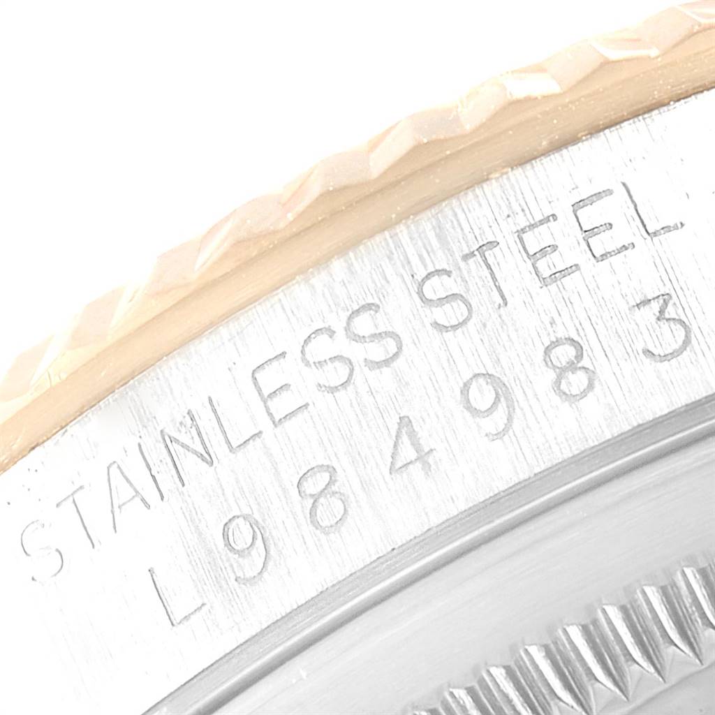 This image shows a close-up view of the stainless steel case and part of the bezel on a Rolex Datejust 16233 Men's Steel and Gold (two tone) Champagne Dial 16233 Men's Steel and Gold (two tone) Champagne Dial watch.