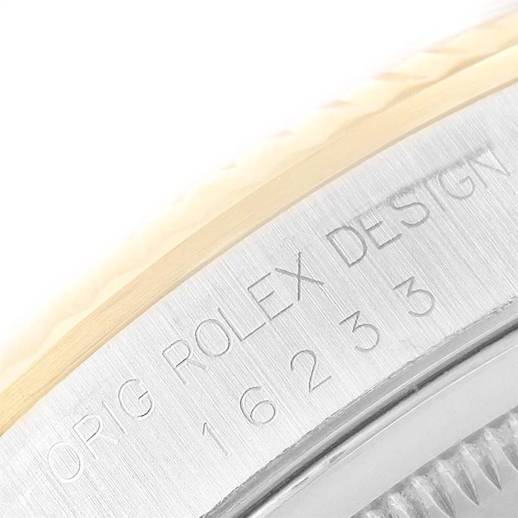 This close-up image shows the engraved side of a Rolex Datejust 16233 Men's Steel and Gold (two tone) Champagne Dial 16233 Men's Steel and Gold (two tone) Champagne Dial watch case with the model number 16233.