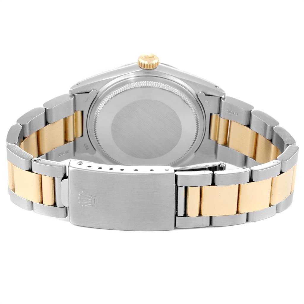 The image shows the back view of the Rolex Vintage Collection 16013 Men's Steel and Gold (two tone) Champagne Dial 16013 Men's Steel and Gold (two tone) Champagne Dial model, focusing on the case back and the two-tone stainless steel and gold bracelet.