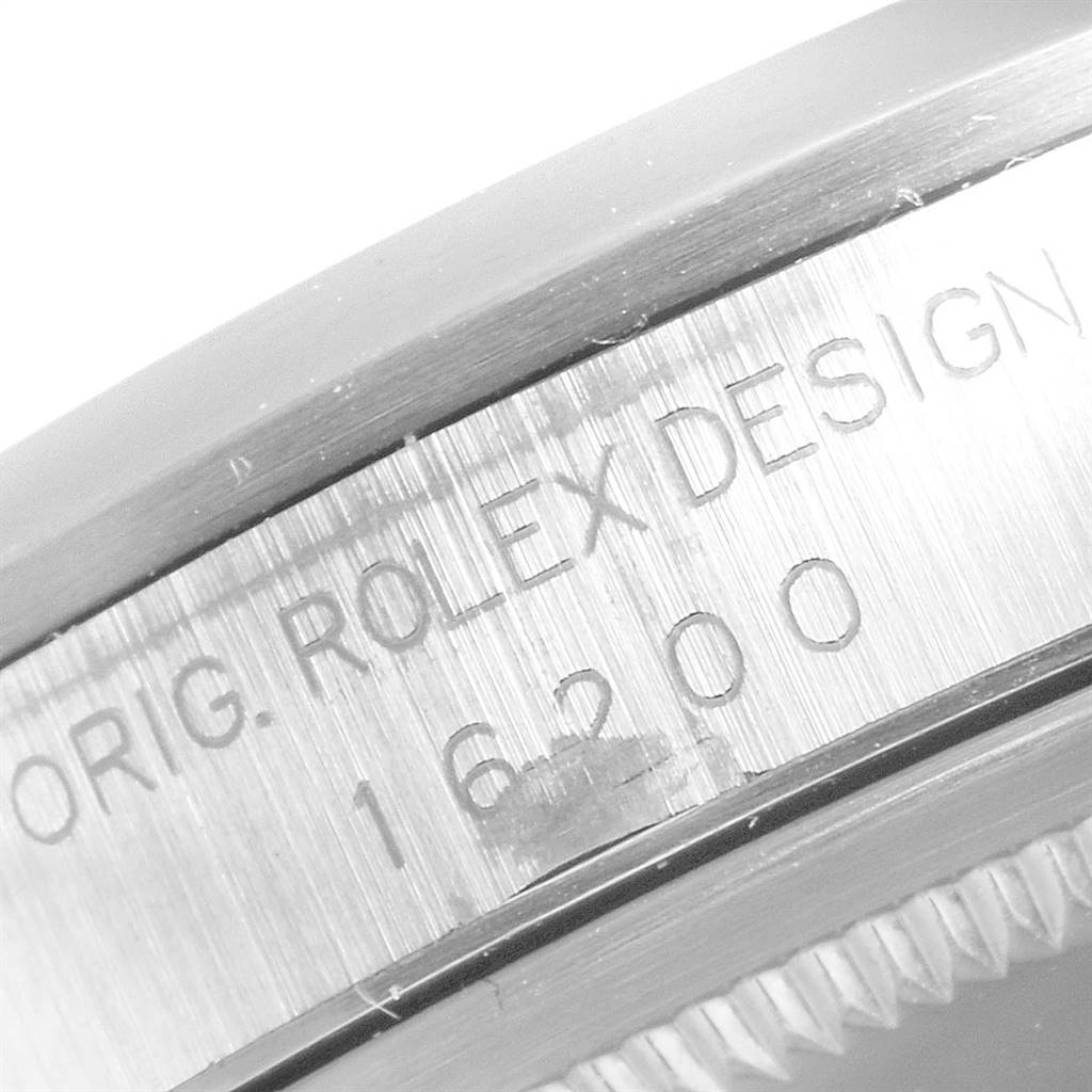 This close-up image of a Rolex Datejust 16200 Men's Stainless Steel Blue Dial 16200 Men's Stainless Steel Blue Dial watch shows the engraving on the side of the case with model number 16200.