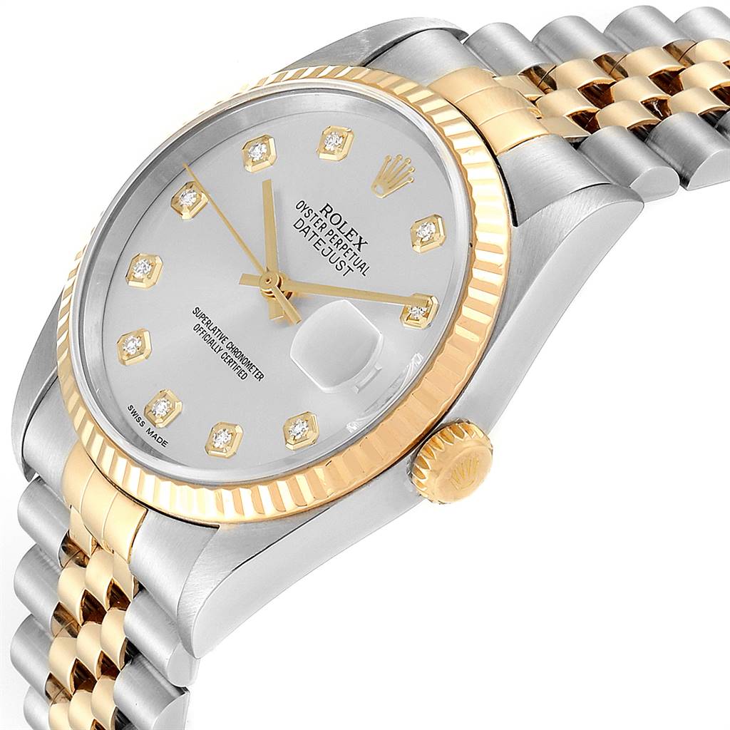 This image shows an angled view of a Rolex Datejust 16233 Men's Steel and Gold (two tone) Silver Dial 16233 Men's Steel and Gold (two tone) Silver Dial watch, highlighting its face, crown, and part of its bracelet.