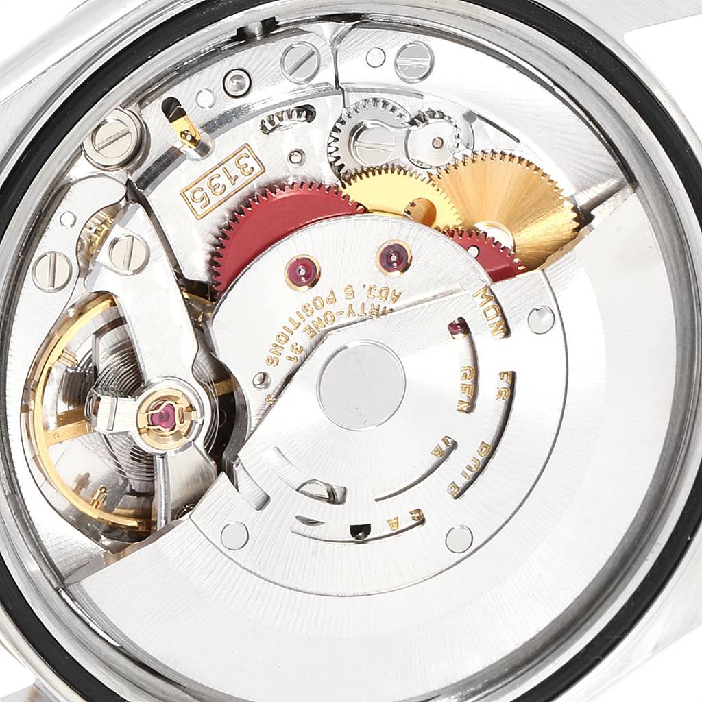 This image shows a close-up view of the internal mechanical movement of a Rolex Datejust 16233 Men
s Steel and Gold (two tone) Champagne Dial 16233 Men
s Steel and Gold (two tone) Champagne Dial watch.