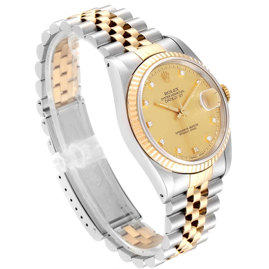 The Rolex Datejust 16233 Men
s Steel and Gold (two tone) Champagne Dial 16233 Men
s Steel and Gold (two tone) Champagne Dial watch is shown from a three-quarter angle, displaying its face, gold dial, two-tone bracelet, and fluted bezel.