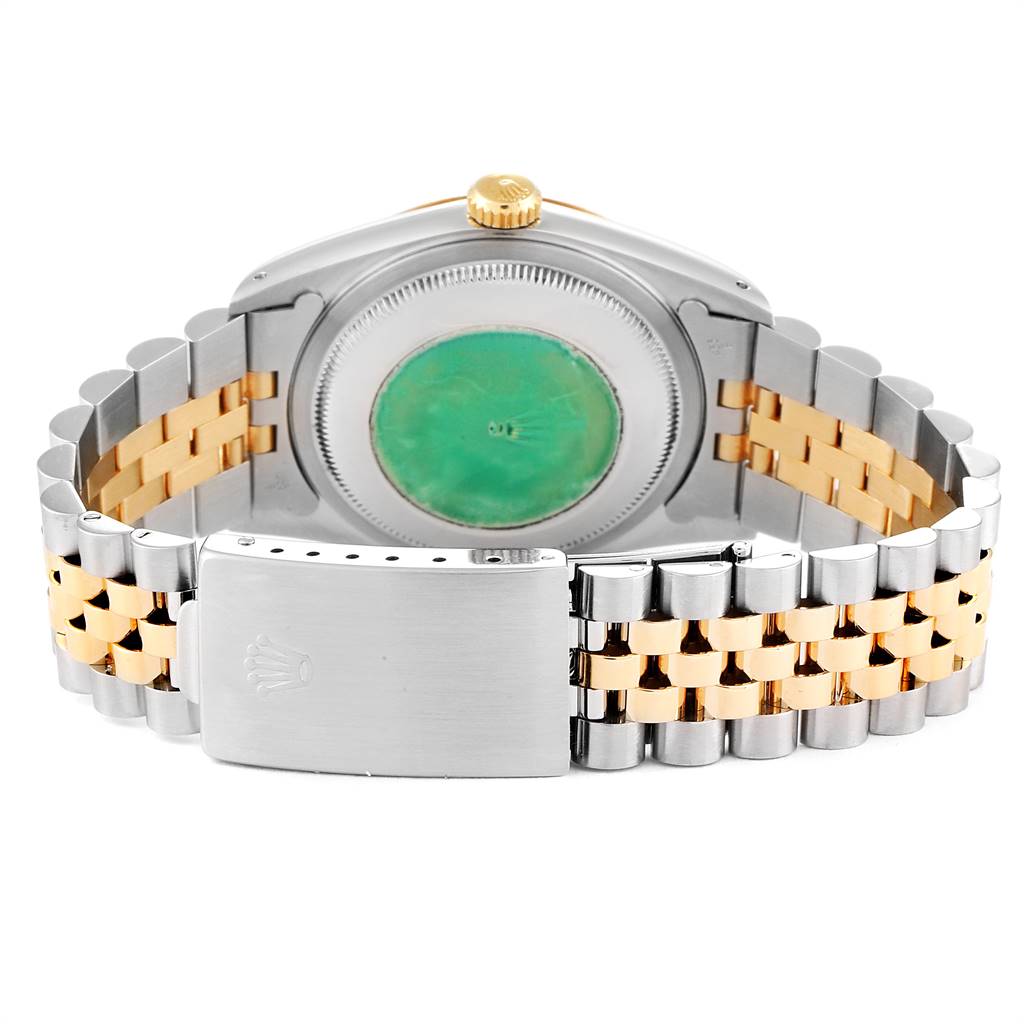 The image shows the back of the Rolex Datejust 16233 Men
s Steel and Gold (two tone) Champagne Dial 16233 Men
s Steel and Gold (two tone) Champagne Dial watch, focusing on the case back and the Jubilee bracelet with the clasp visible.