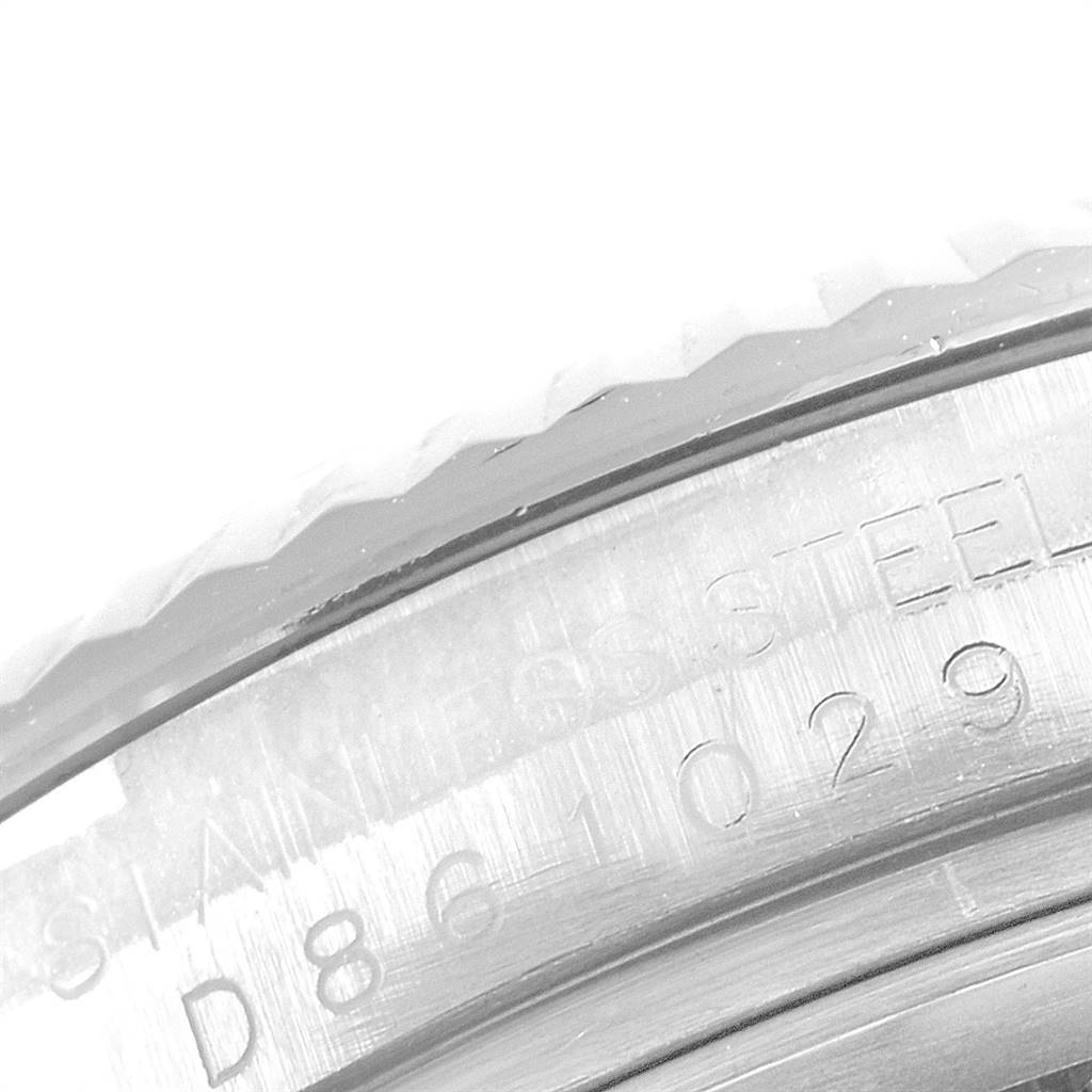 This close-up image shows the stainless steel engraving on the bezel of a Rolex Datejust 116234 Men
s Stainless Steel Grey Dial 116234 Men
s Stainless Steel Grey Dial watch.