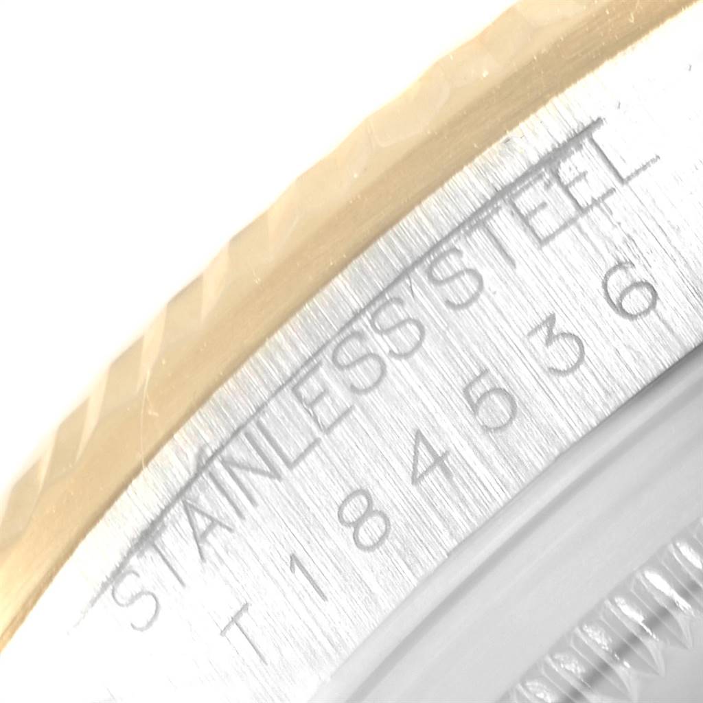 This image shows a close-up of the stainless steel case and bezel of a Rolex Datejust 16233 Men
s Steel and Gold (two tone) Champagne Dial 16233 Men
s Steel and Gold (two tone) Champagne Dial watch.