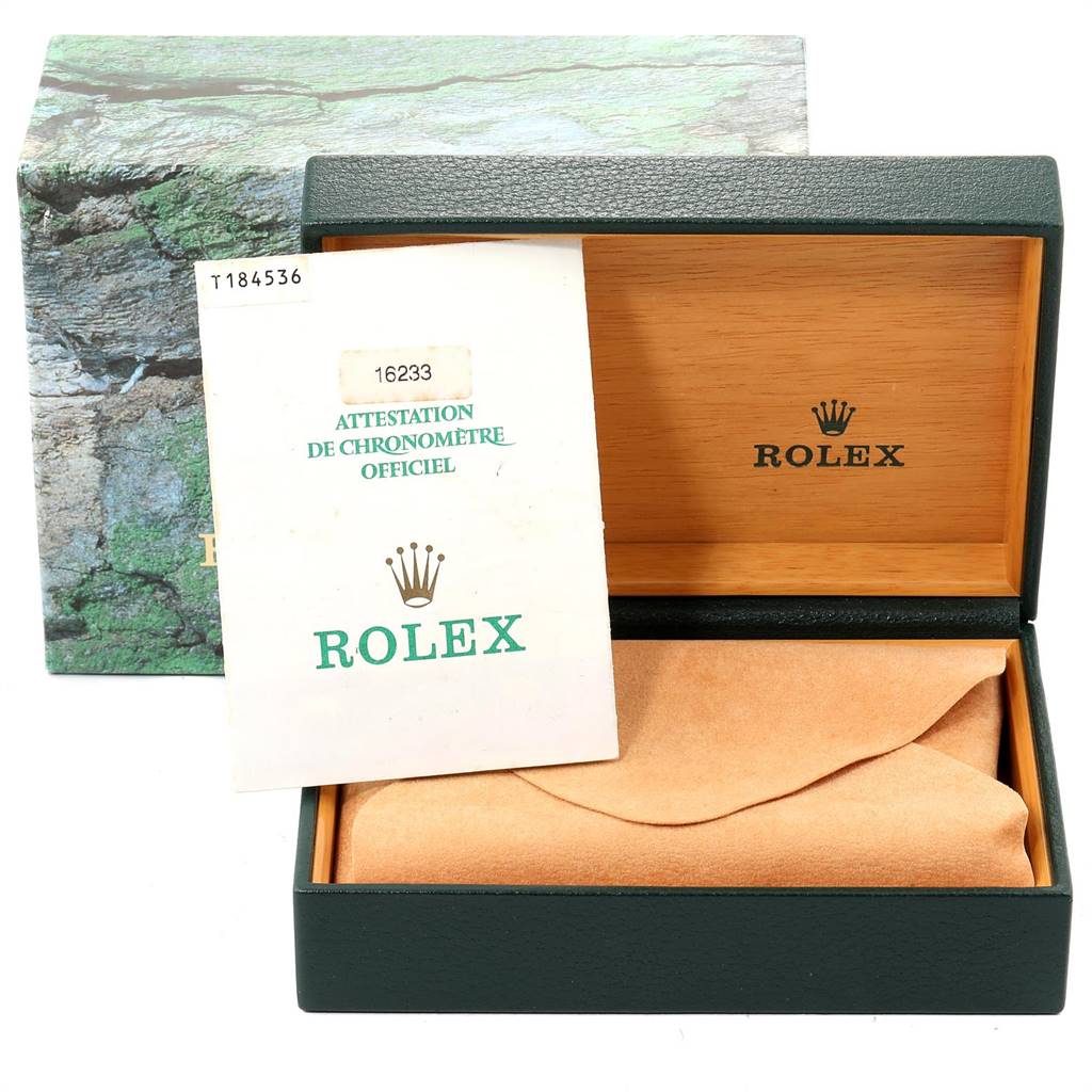 This image shows the packaging and official documents for a Rolex Datejust 16233 Men
s Steel and Gold (two tone) Champagne Dial 16233 Men
s Steel and Gold (two tone) Champagne Dial watch.