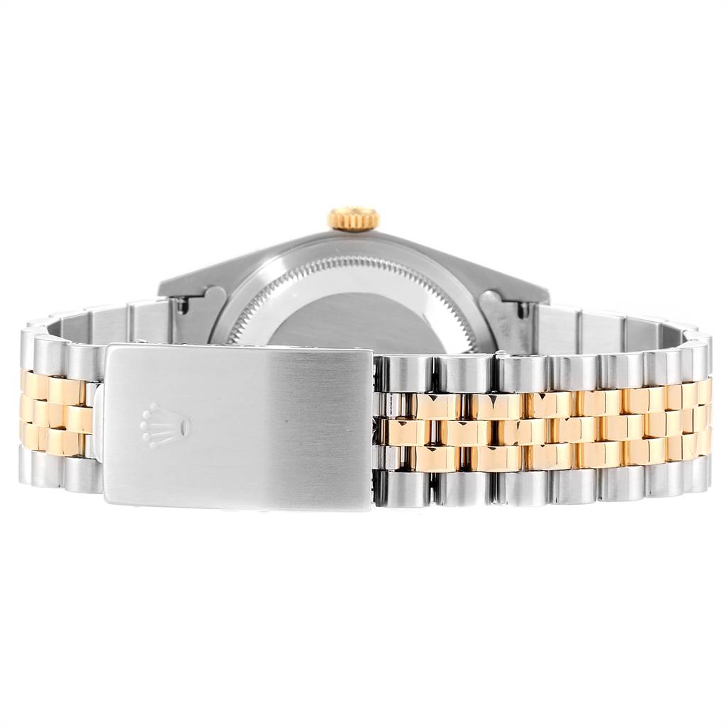 The image shows the clasp and bracelet of a Rolex Datejust 16233 Men
s Steel and Gold (two tone) Champagne Dial 16233 Men
s Steel and Gold (two tone) Champagne Dial watch, viewed from the back.