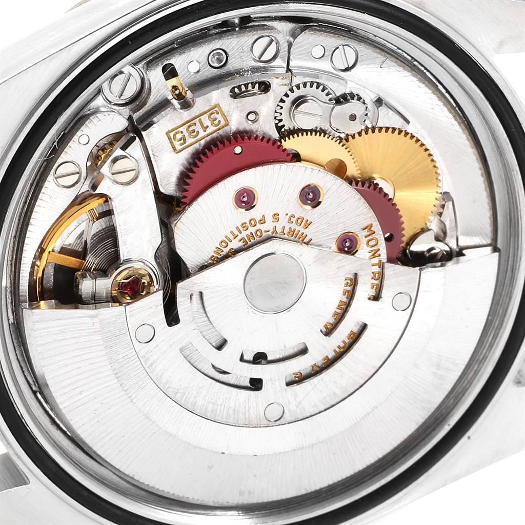 This image shows the intricate movement and inner components of the Rolex Datejust 16233 Men's Steel and Gold (two tone) Blue Dial 16233 Men's Steel and Gold (two tone) Blue Dial watch model from an internal angle.