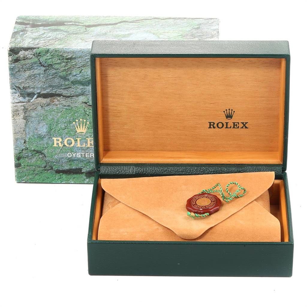 The image shows an open Rolex Datejust 16233 Men's Steel and Gold (two tone) Blue Dial 16233 Men's Steel and Gold (two tone) Blue Dial box with a suede pouch and tag inside, presenting a front angle view of the box.