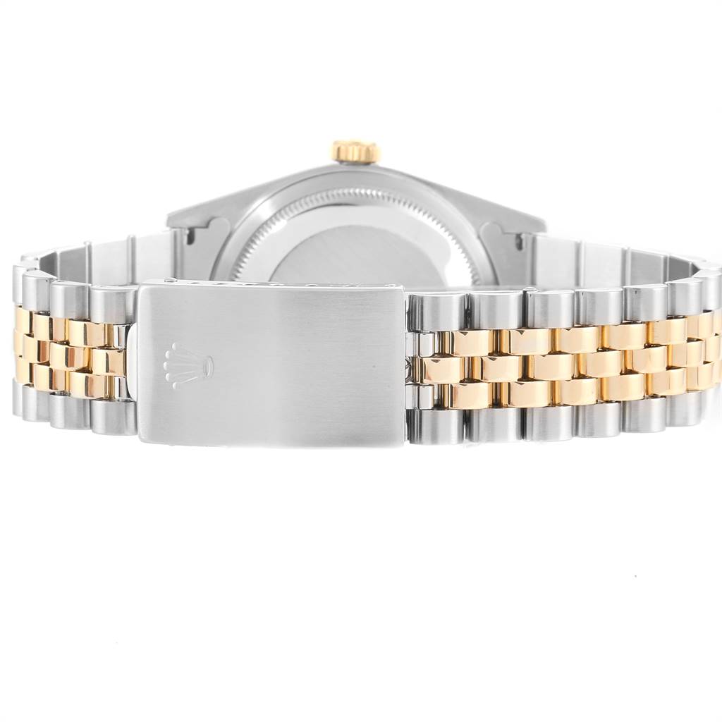 The image shows the back view of a Rolex Datejust 16233 Men's Steel and Gold (two tone) Blue Dial 16233 Men's Steel and Gold (two tone) Blue Dial watch, highlighting the clasp and bi-color bracelet.