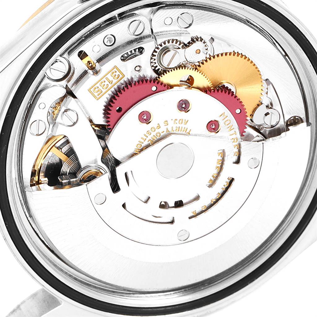 This image shows the internal mechanism and movement components of a Rolex Datejust 16233 Men
s Steel and Gold (two tone) Champagne Dial 16233 Men
s Steel and Gold (two tone) Champagne Dial watch from a back angle.