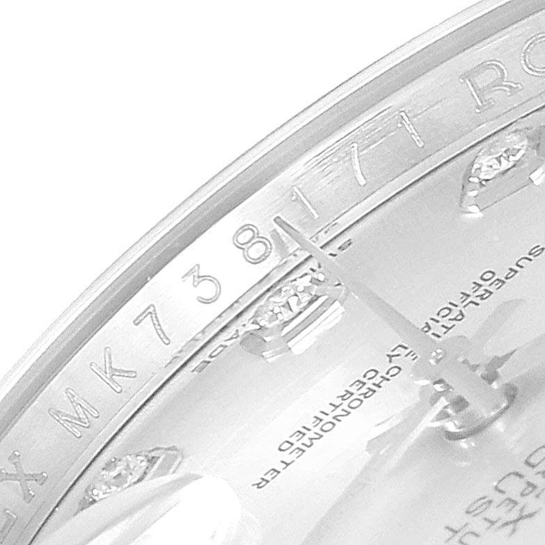 The image shows a close-up of the dial and the inner bezel of a Rolex Datejust 116234 Men's Stainless Steel Silver Dial 116234 Men's Stainless Steel Silver Dial watch, highlighting some serial numbers and text.