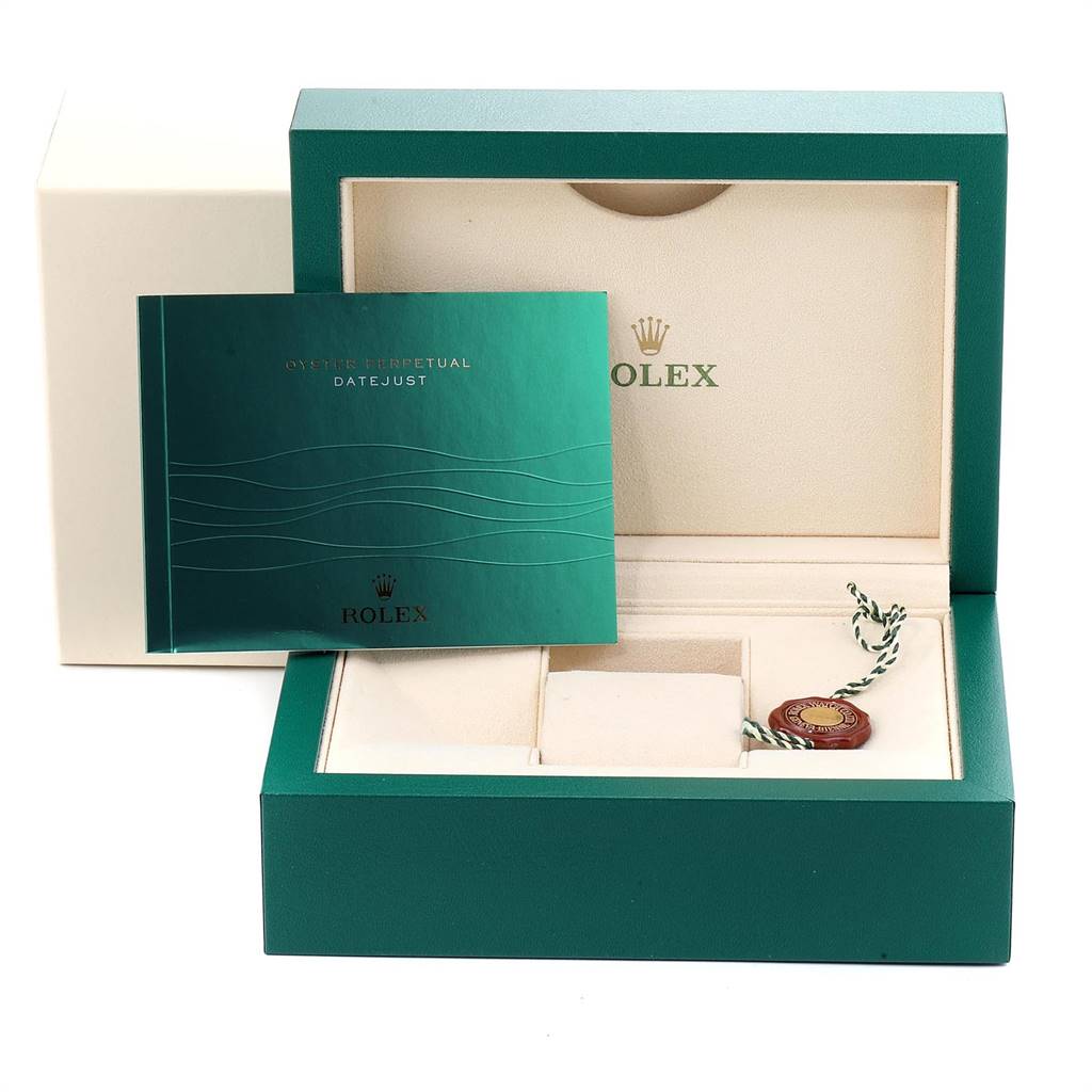 The image shows the open box of a Rolex Datejust 116234 Men's Stainless Steel Silver Dial 116234 Men's Stainless Steel Silver Dial watch, displaying the manual and an accessory tag.