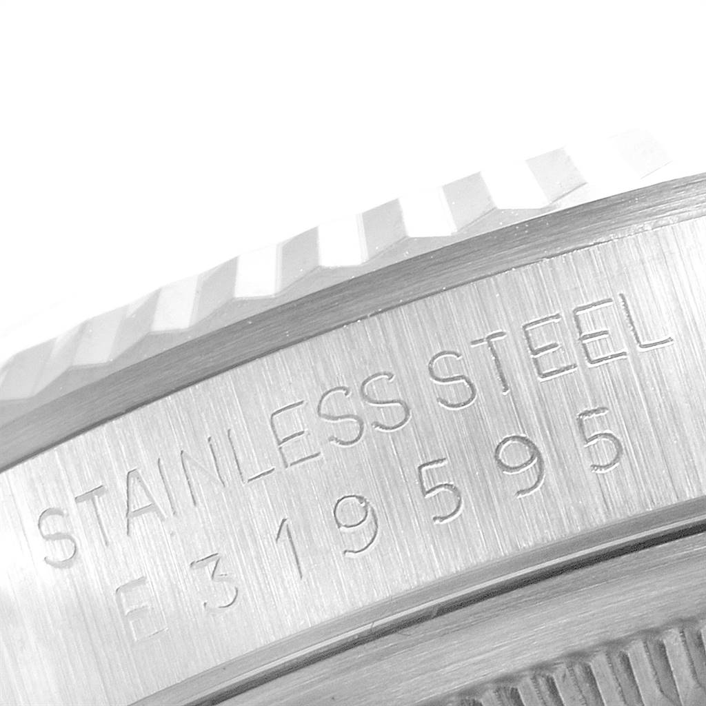 This image shows a close-up of a stainless steel side casing and fluted bezel of a Rolex Datejust 16234 Men's Stainless Steel Silver Dial 16234 Men's Stainless Steel Silver Dial watch.