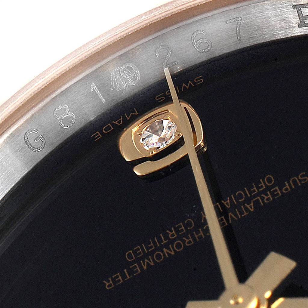 The image shows a close-up of the dial and bezel of a Rolex Datejust 116233 Men's Stainless Steel Black Dial 116233 Men's Stainless Steel Black Dial watch, highlighting the serial number and details on the face.