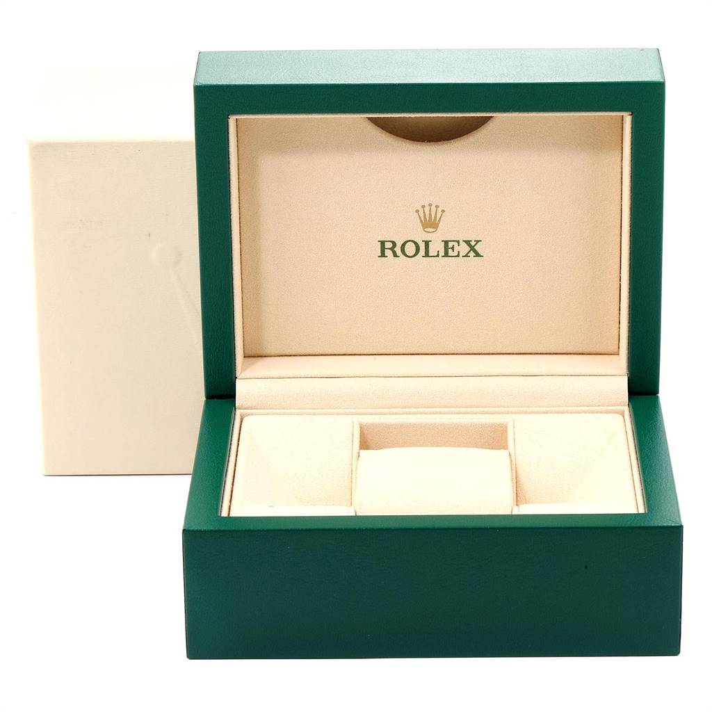 The image shows an open green and beige Rolex Datejust 116233 Men's Stainless Steel Black Dial 116233 Men's Stainless Steel Black Dial watch box, displaying the interior branding and compartments.