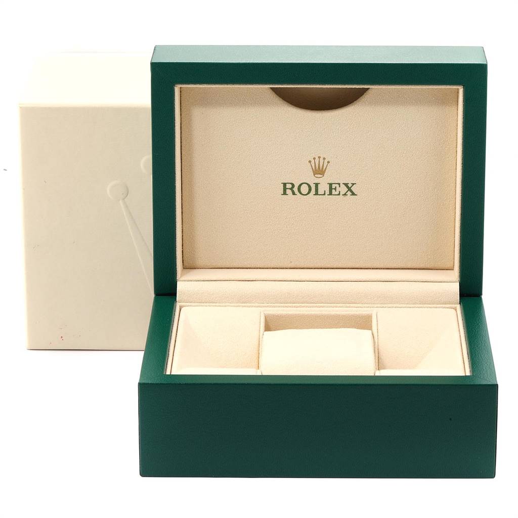 The image shows a green and beige Rolex watch box for the Datejust model, with the lid open and the Rolex logo inside.