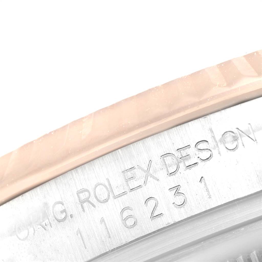 A close-up angle showing the engraved model number and "Rolex Design" on the case of the Rolex Datejust 116231 Men
s Steel and Gold (two tone) White Dial 116231 Men
s Steel and Gold (two tone) White Dial watch.