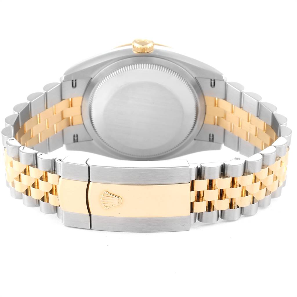 The image shows the backside and bracelet clasp of a Rolex Datejust 126233 Men's Steel and Gold (two tone) Mother of Pearl Dial 126233 Men's Steel and Gold (two tone) Mother of Pearl Dial watch, highlighting its two-tone metal elements.